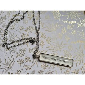 Rectangle pendant necklace made with The House in the Cerulean Sea book pages